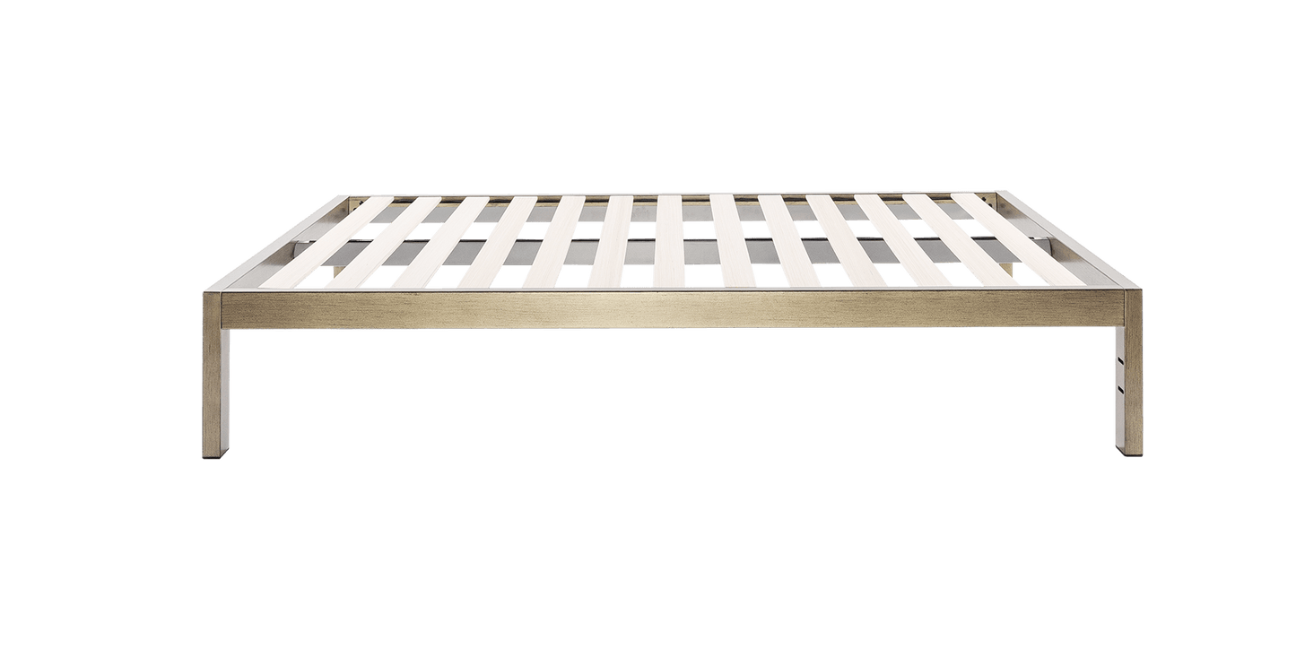 Keetsa The Frame bed frame in gold brushed finish, side view showing slim steel profile with wooden slat support and four square legs providing generous under-bed clearance.
