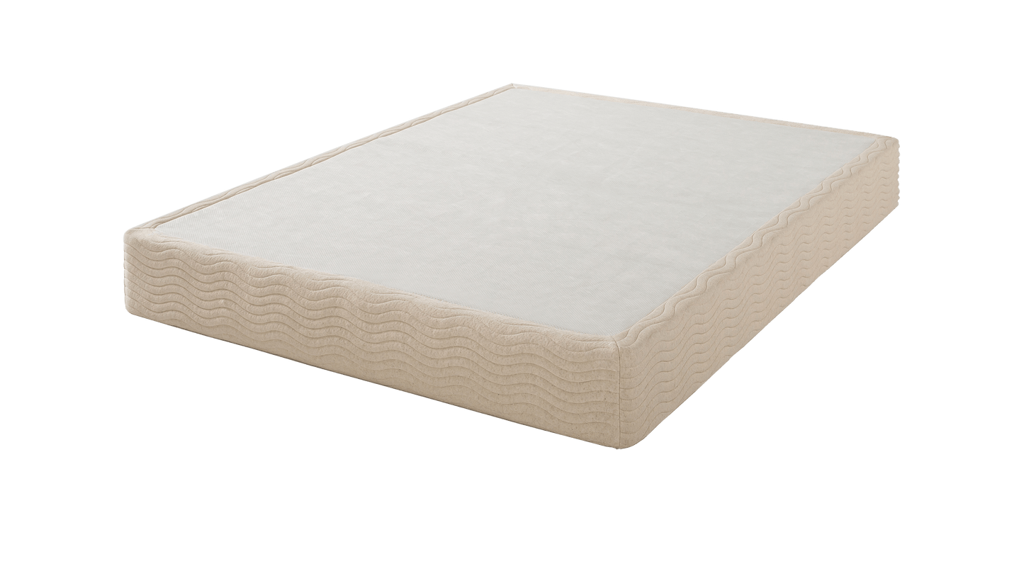 The Base - Steel Box Spring paired with a single beige mattress featuring textured wave-patterned sides and a smooth sleeping surface, designed to provide stable, even support for foam or hybrid mattresses.