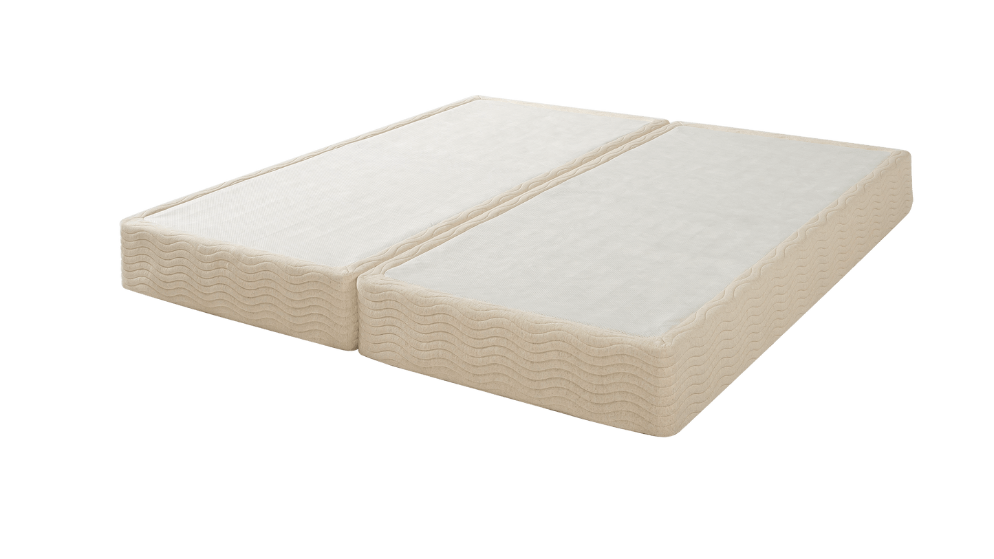 The Base - Steel Box Spring shown with two beige split mattresses side by side, featuring quilted wave-stitched sides and smooth top panels, compatible with adjustable bases for independent head and foot positioning.