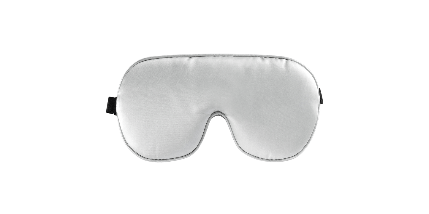 Keetsa sleep eye mask front view showing smooth silver satin side with contoured nose bridge cutout and black adjustable strap tab on the side.