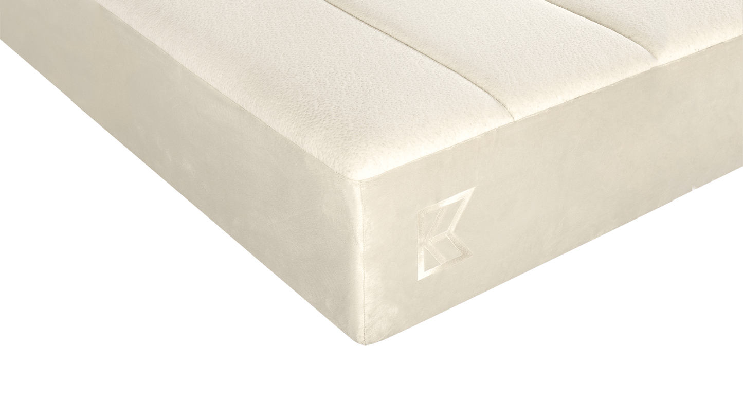 Keetsa Tea Leaf Supreme mattress corner close-up featuring a smooth, tailored cover and subtle embroidered Keetsa logo, showcasing refined craftsmanship and durable construction.