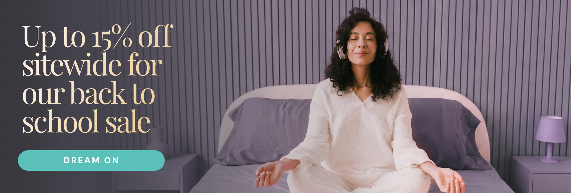 Keetsa Back to School Sale banner: 'Up to 15% off sitewide for our back to school sale' with 'Dream on' call-to-action button, showing woman meditating cross-legged in white sherpa loungewear on gray bedding with slatted headboard