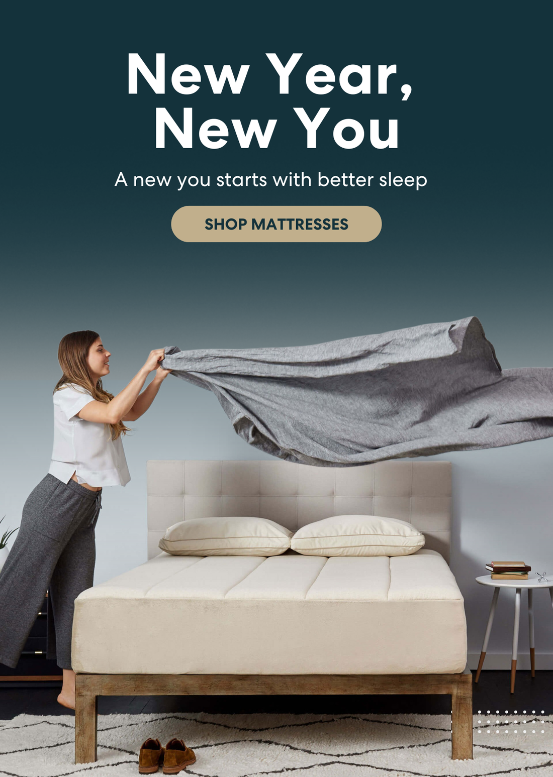 New Year, New You mattress promotion by Keetsa showing a modern upholstered bed as a woman spreads a gray blanket, conveying better sleep to start the year; includes call to action to shop mattresses for improved comfort and rest.