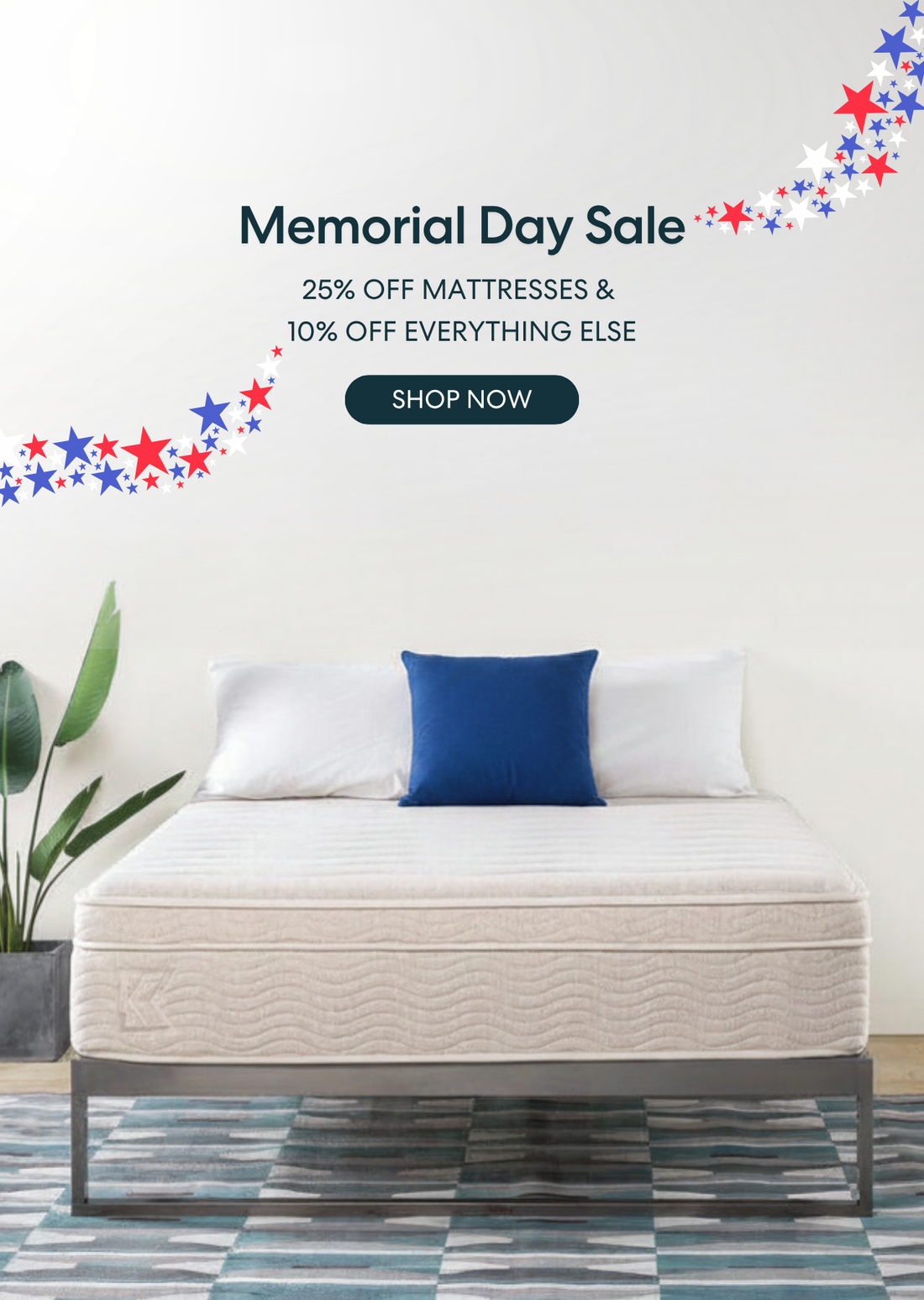 Memorial Day mattress sale offering 25% off mattresses and 10% off everything else, shown with a modern bedroom featuring a low-profile bed, blue throw blanket, and patriotic red, white, and blue stars; includes a “Shop Now” call to action.
