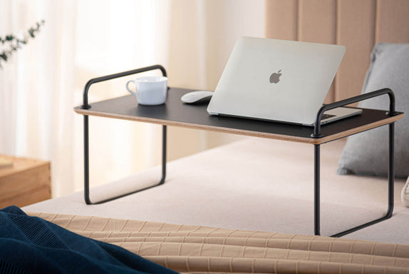 Bedside table with laptop