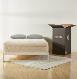 Keetsa best value bedding products with mattress and two pillows pictured next to packaging box