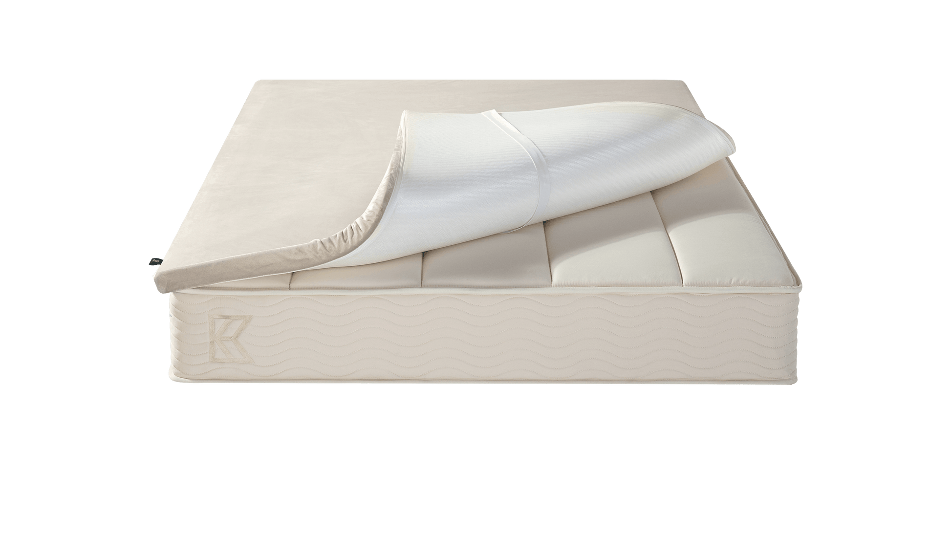 Keetsa Basic Comfort Layer mattress topper partially lifted to reveal elastic corner straps, highlighting its secure fit design that helps keep the topper in place while adding an extra layer of cushioning comfort.