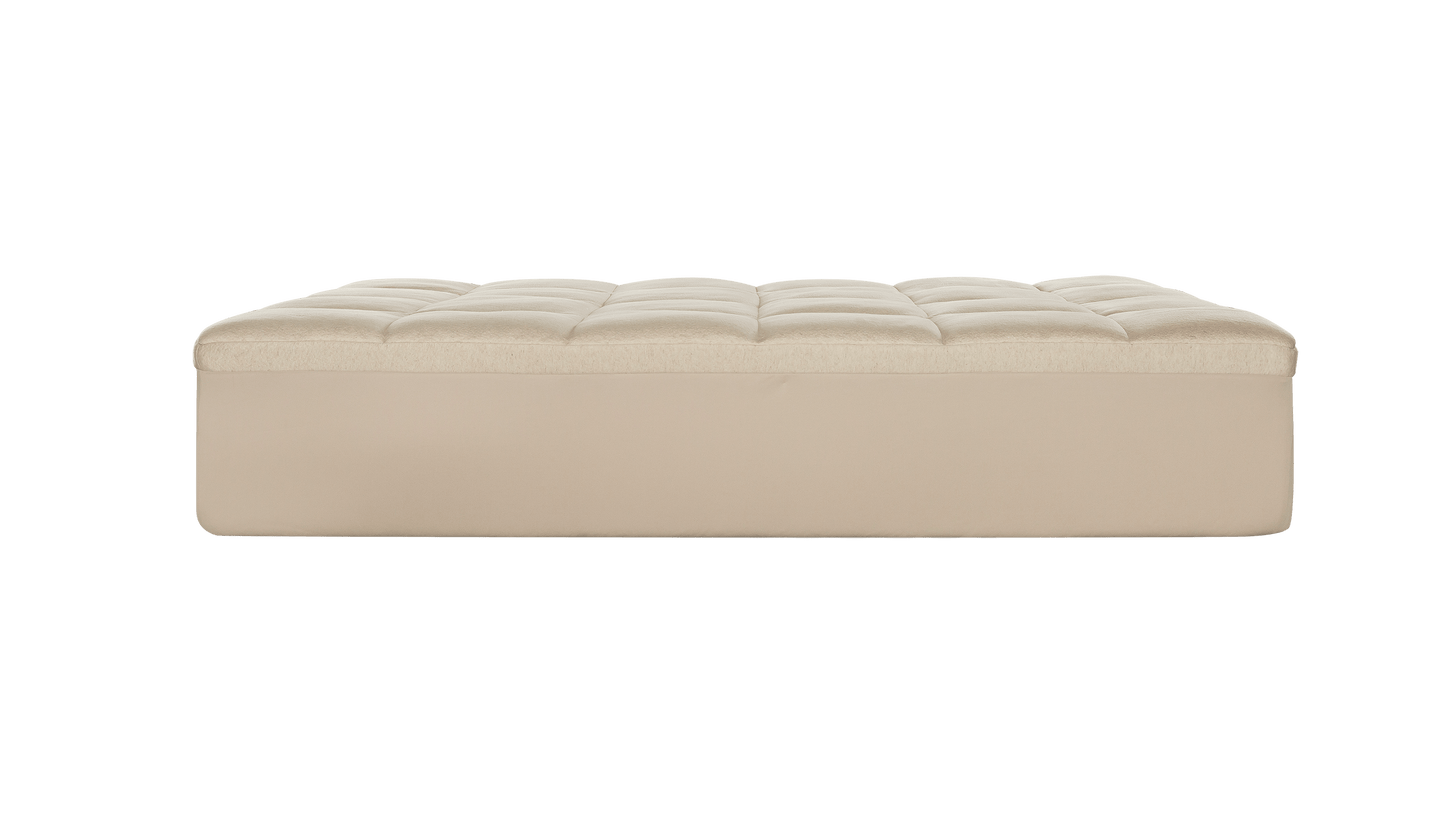 Keetsa Luxurious Comfort Layer shown in side profile featuring a plush, tufted top surface designed to add an extra layer of cushioning and pressure relief to your mattress for enhanced softness and comfort.