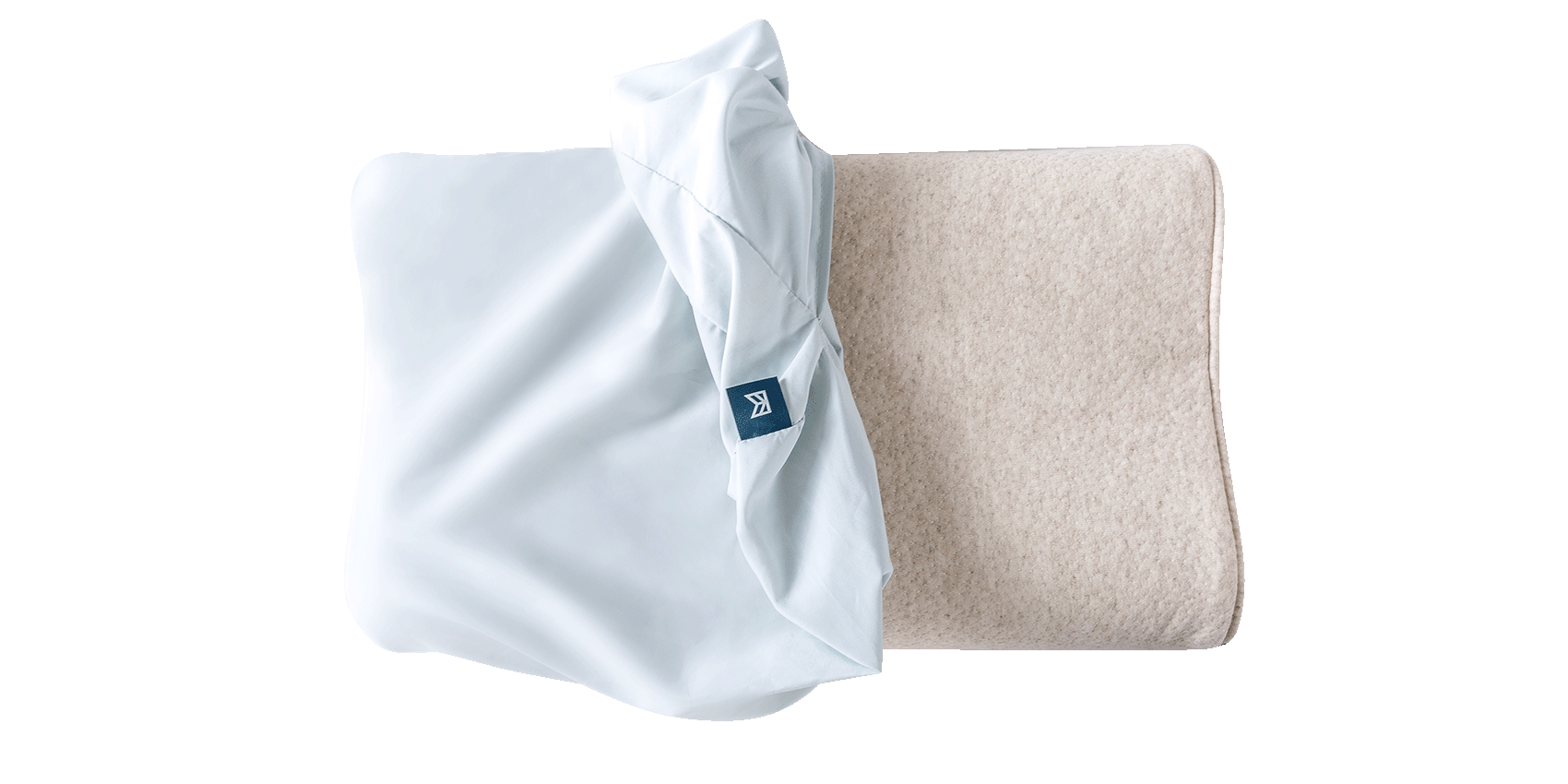 Keetsa Anti-Mite and Sweat-Resistant Pillow Protector partially unzipped to reveal pillow insert, demonstrating its secure zippered closure and full-coverage design that helps shield against allergens and moisture