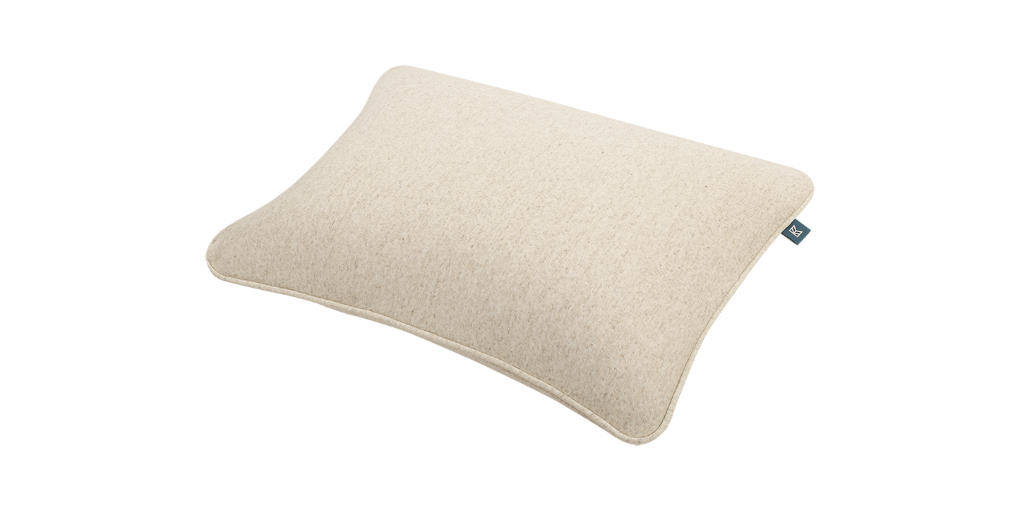 Keetsa Soft Dual Comfort Pillow angled side view displaying its gently contoured profile and even fill distribution, engineered with dual comfort construction to provide soft cushioning and reliable neck support for side and back sleepers.