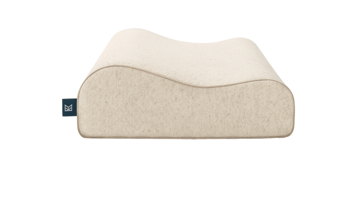 Keetsa Tea Leaf Contour Pillow in natural beige with an ergonomic curved design that cradles the head and supports the neck, engineered to promote proper spinal alignment and relieve pressure for side and back sleepers seeking structured, responsive comfort.