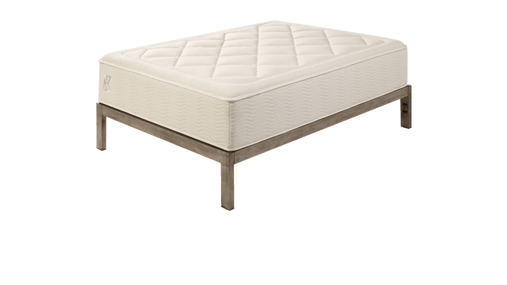 Tea Leaf Dream® mattress angled side view highlighting its quilted pillow-top surface and wave-stitched side panels, designed to provide pressure-relieving comfort, stable support, and a refined upholstered appearance.