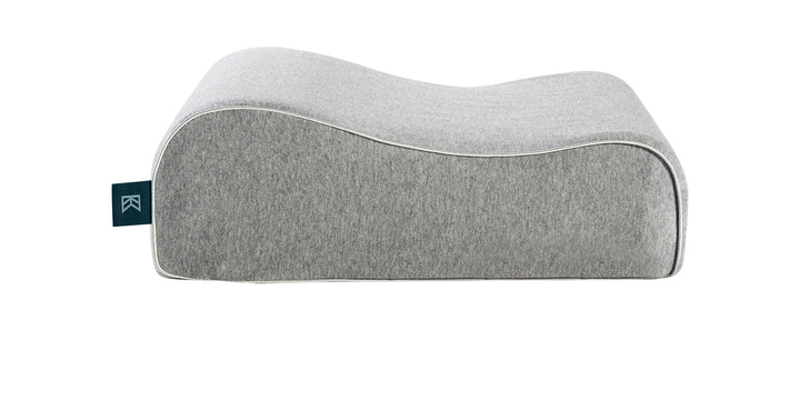 Zinus Keetsa Siesta pillow in heather gray, side profile showing dual-height contoured design with raised neck support and lower head cradle, white piping, and branded Keetsa tag.
