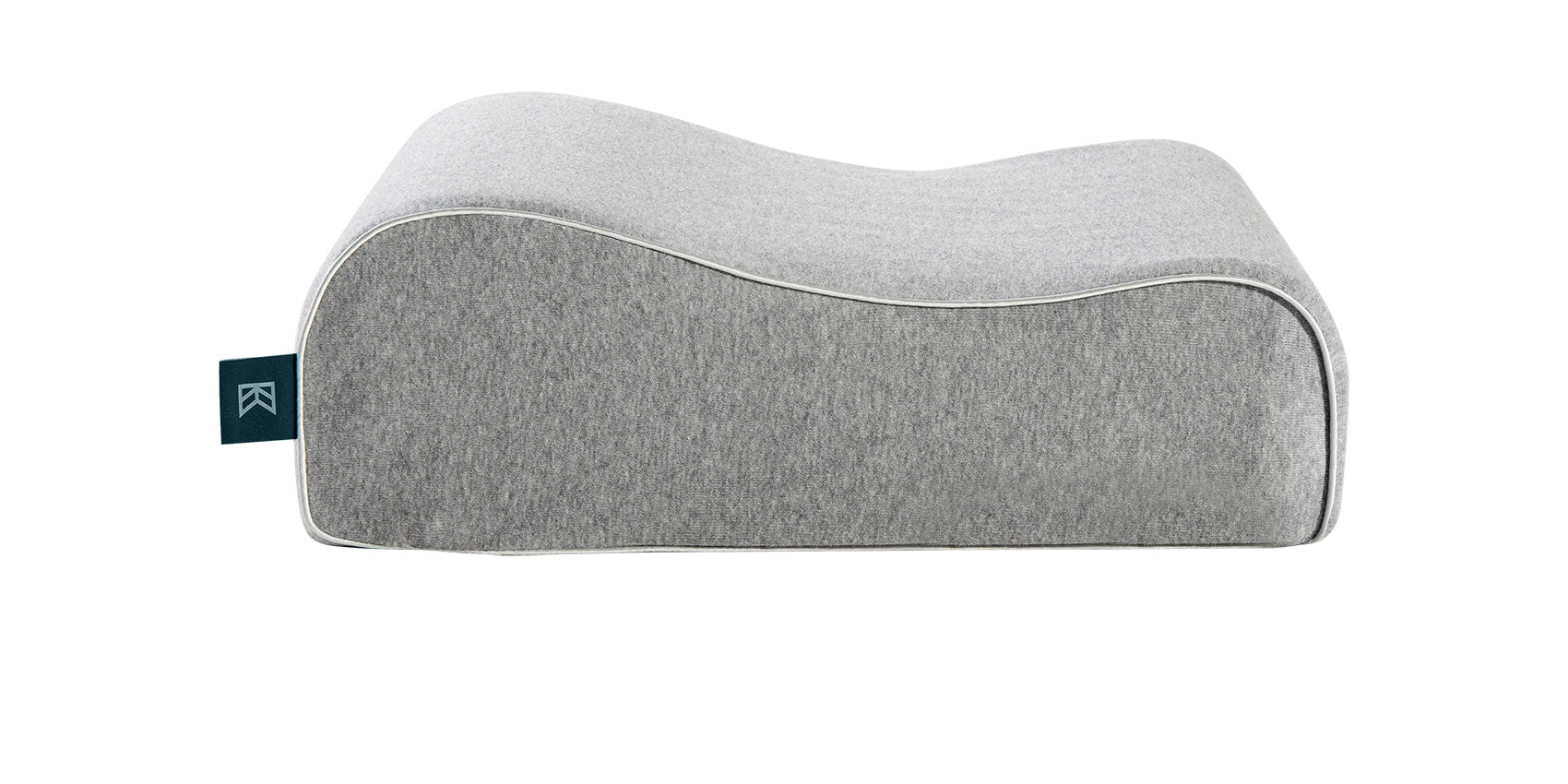 Keetsa Siesta pillow in heather gray, side profile showing dual-height contoured design with raised neck support and lower head cradle, white piping, and branded Keetsa tag.