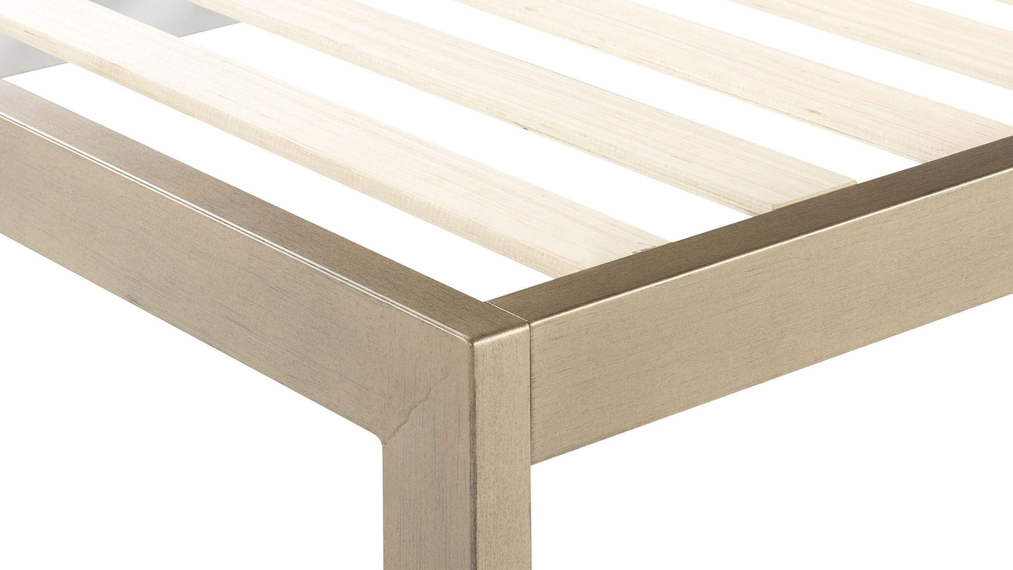 Keetsa The Frame bed frame close-up corner detail showing gold brushed steel finish, precise mitered joint construction, square leg, and wooden slat support system.