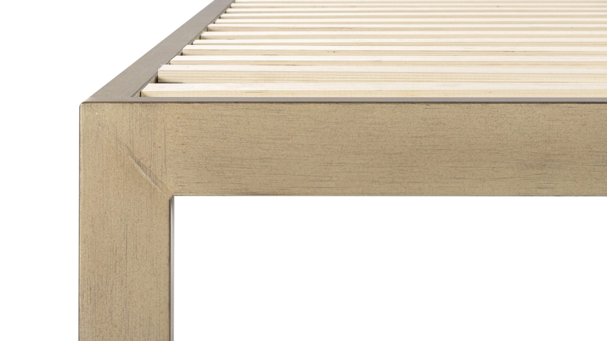 Keetsa The Frame bed frame close-up of corner joint and leg showing warm gold brushed steel texture, clean square profile, and closely spaced wooden slats for mattress support.